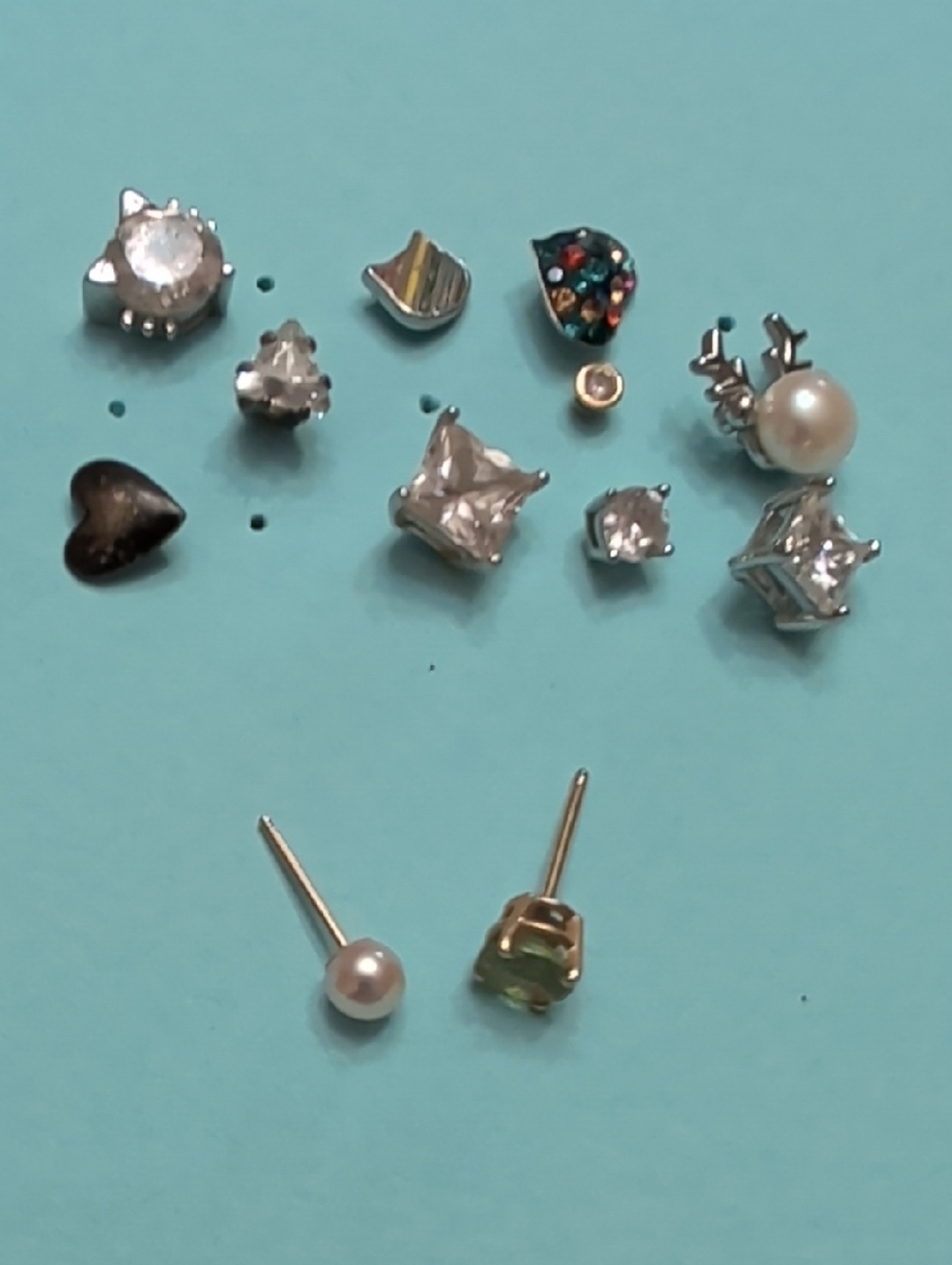14k Gold (2)  And Sterling Silver Single Stud Earrings.